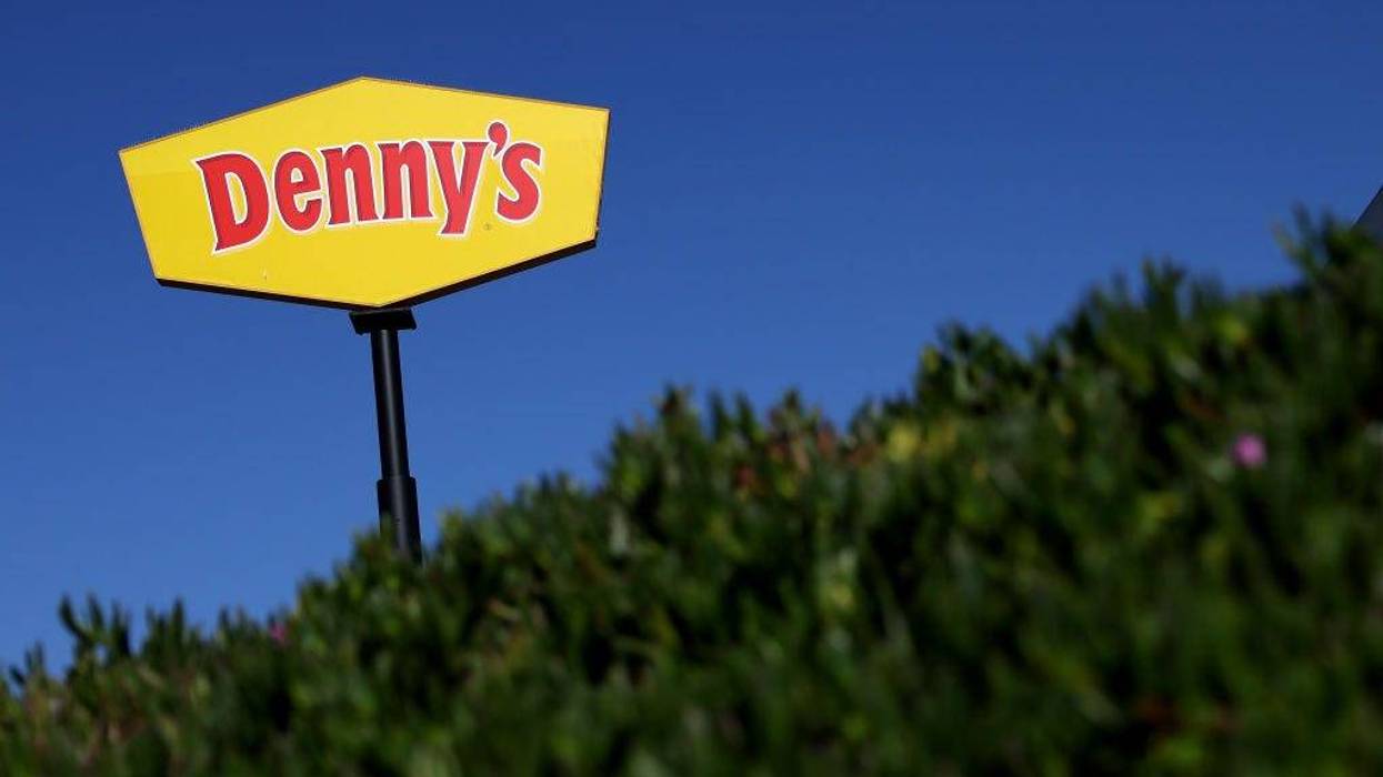 A sign is posted in front of a Denny's restaurant on February 13, 2023 in Emeryville, California.