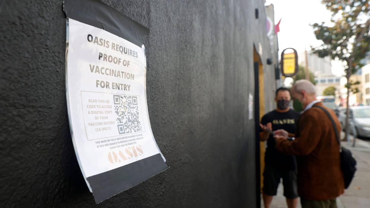 A sign is posted on the front of Oasis announcing that proof of vaccination is required for entry into the club on July 29, 2021 in San Francisco, California.
