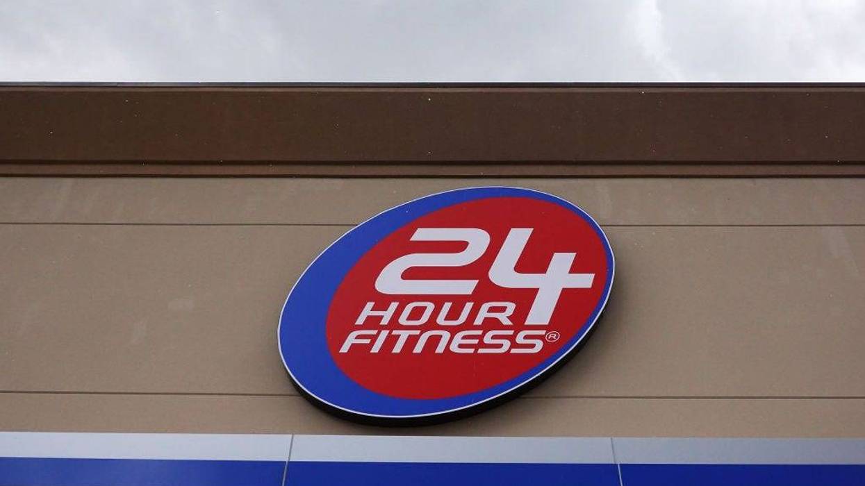 A sign is seen on the outside of a 24 Hour Fitness gym on June 15, 2020 in Miami, Florida.