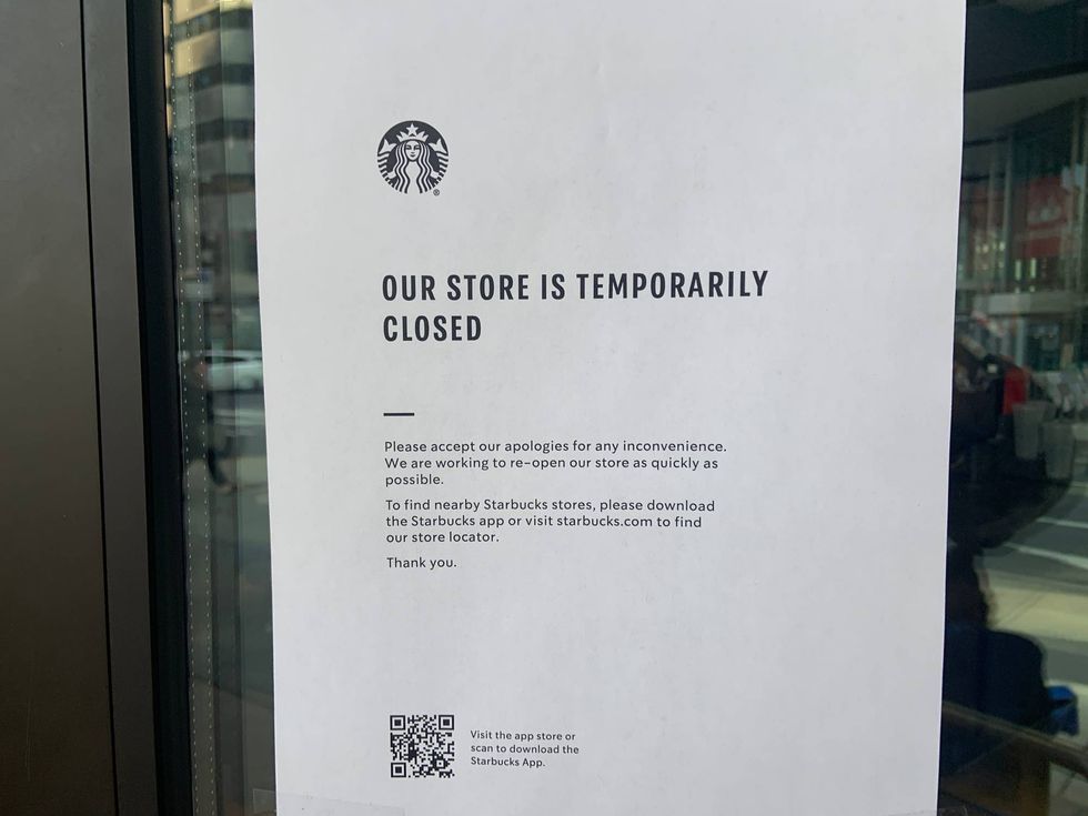 A sign notifying customers that a Center City Starbucks location is closed due to a one-day protest by union members.