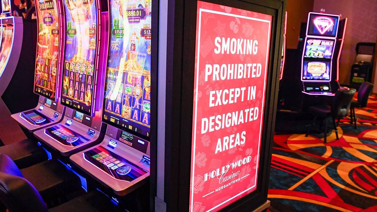 A sign on the end of a row of slot machines reads "Smoking Prohibited Excepts in Designated Areas" at the Hollywood Casino Morgantown, Dec. 17, 2021, Morgantown, Pennsylvania.