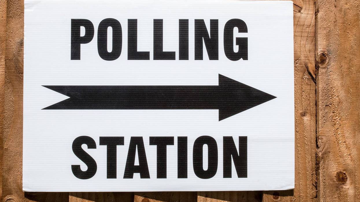 A sign pointing in the direction of a Polling Station on election day