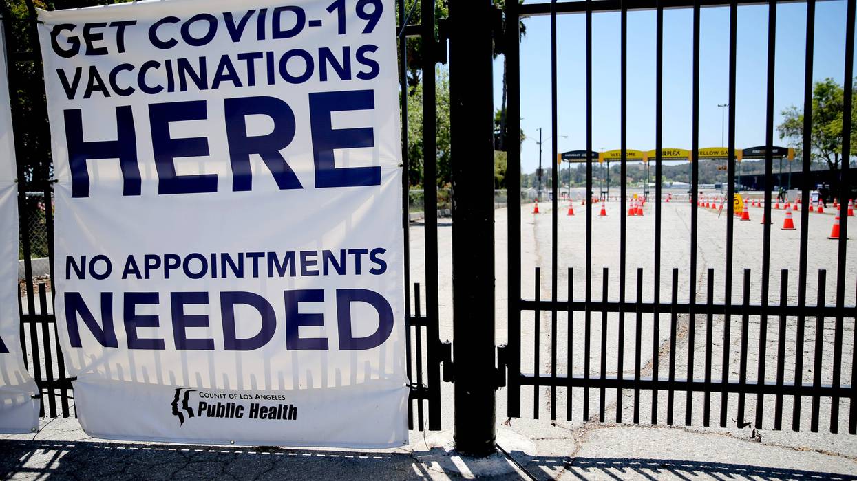 A sign promotes a nearly empty mass vaccination site at the Pomona Fairplex on June 10, 2021 in Pomona, California.