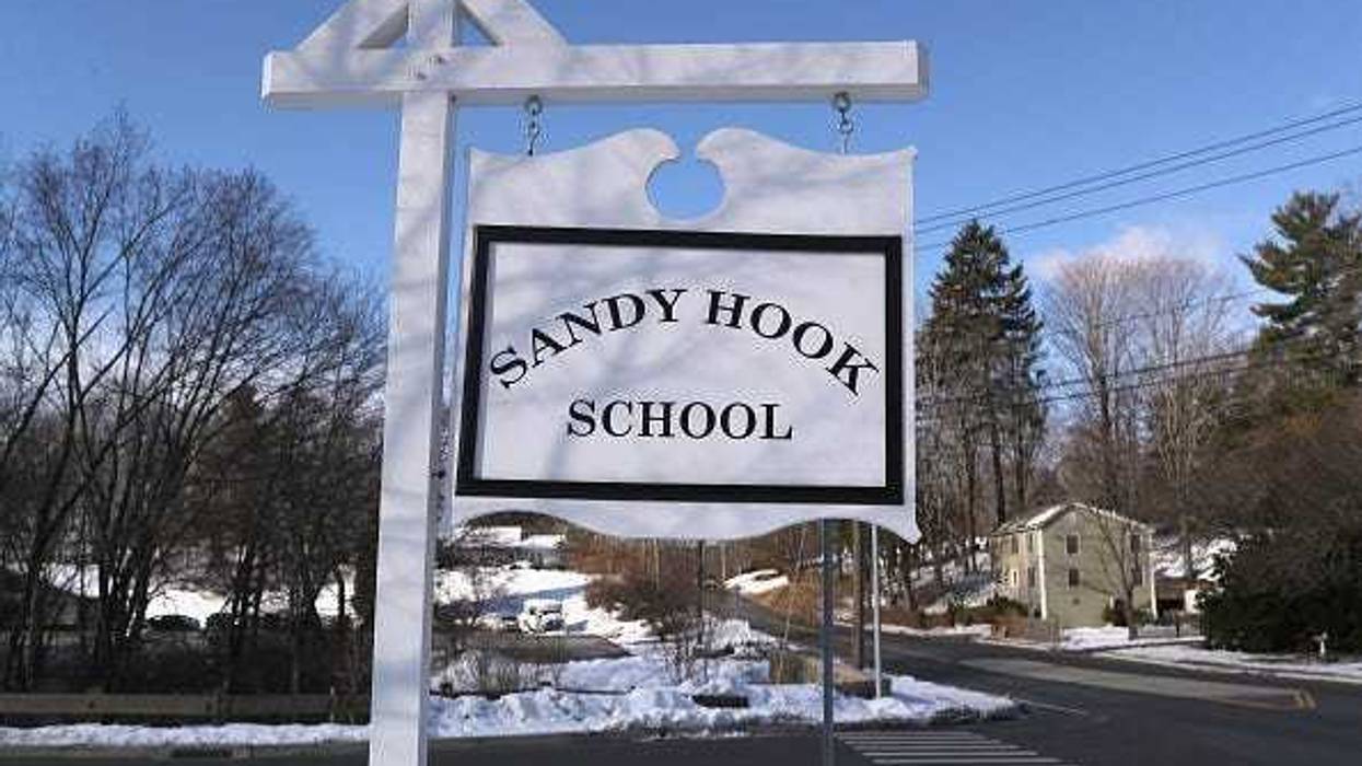 A sign stands near the site of the December 2012 Sandy Hook school shooting