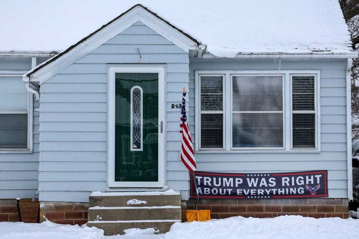 A sign supporting Republican presidential candidate former President Donald Trump is displayed on a house on January 11, 2024 in Ogden, Iowa.
