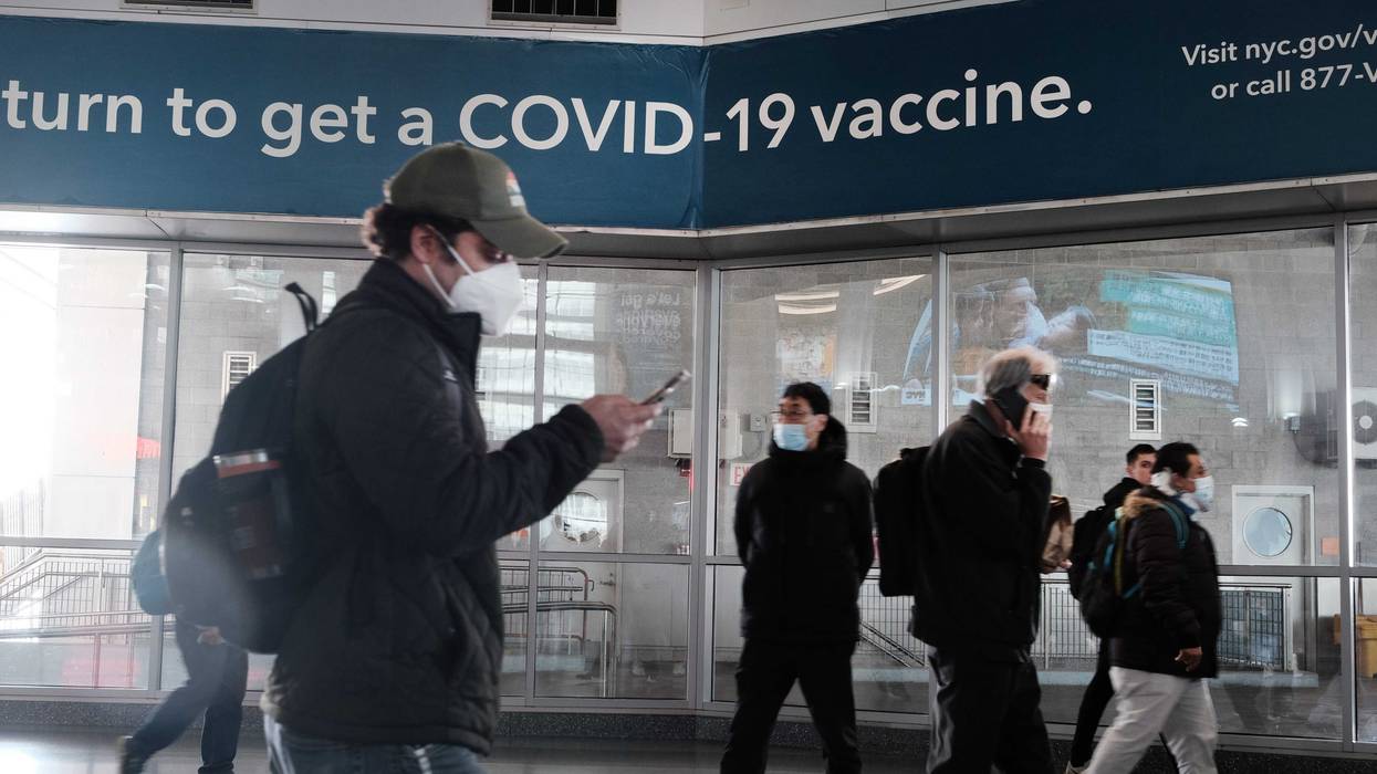 A sign urges people to get the Covid vaccine at the Staten Island Ferry terminal on Nov. 29, 2021 in New York City