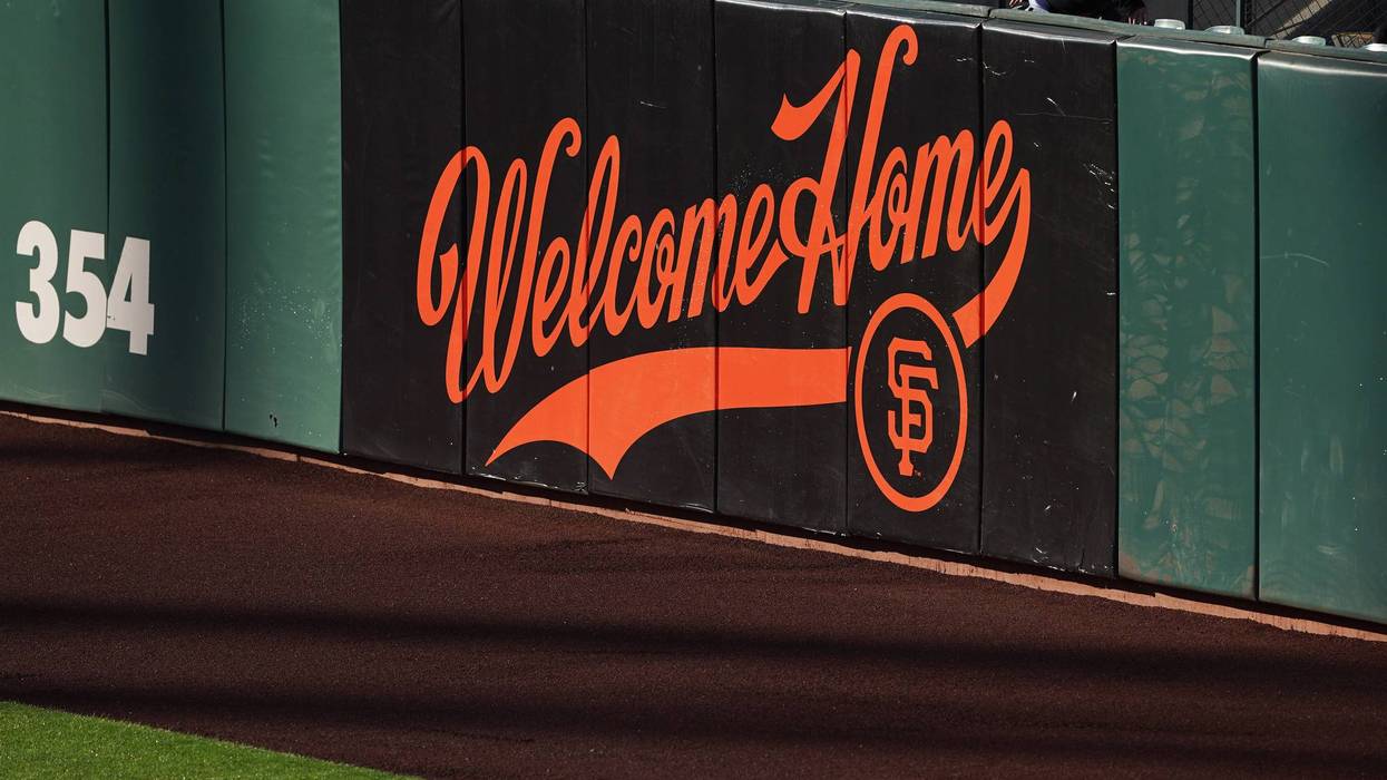 A sign welcoming fans is painted on the outfield wall as seen before the game between the San Francisco Giants and the Los Angeles Dodgers at Oracle Park.