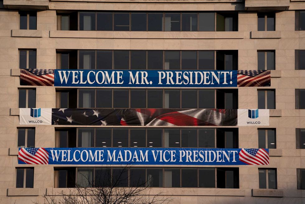 A sign welcoming the new President and Vice President is displayed on a building near Freedom Plaza on January 14, 2021 in Washington, DC. Security has been increased throughout Washington following the breach of the U.S. Capitol last Wednesday, and leading up to the Presidential Inauguration.