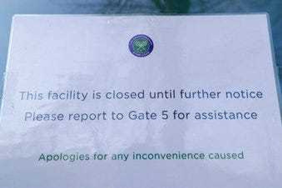 A signs outside one of the main gates to Wimbledon as it is announced the the Wimbledon tennis Championships for 2020 has bee. n cancelled due to the coronavirus in London. (AP Photo/Kirsty Wigglesworth)