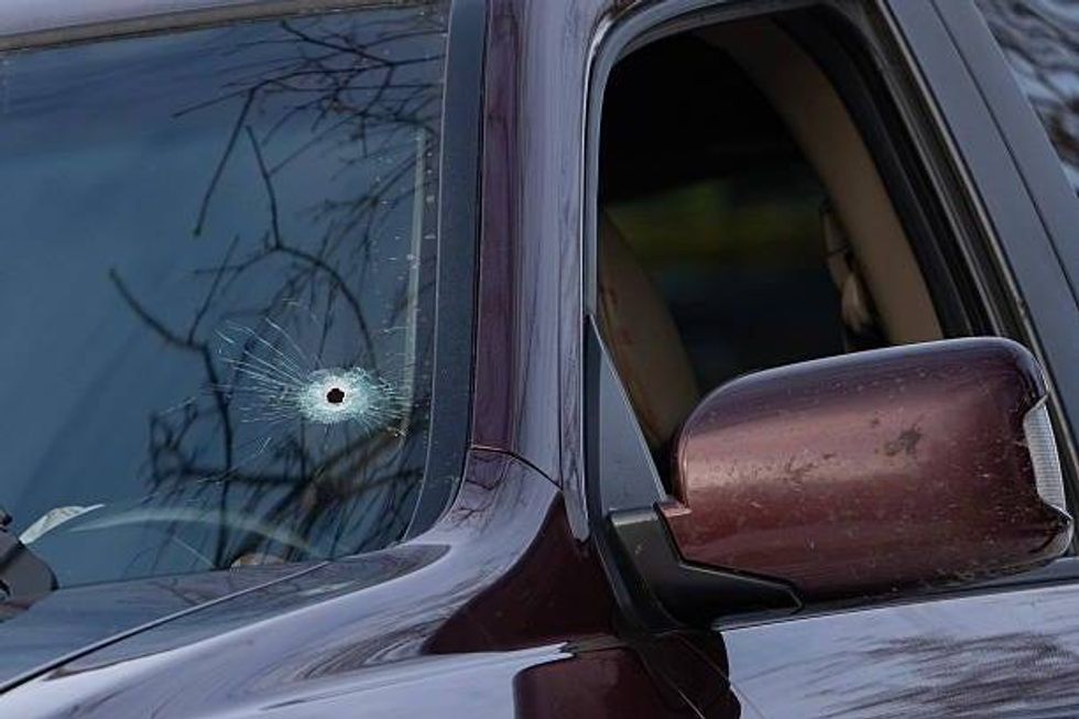 A single bullet hole can be seen on the driver
