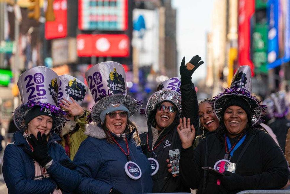 A small crowd of revelers celebrate in Times Square prior to the New Year