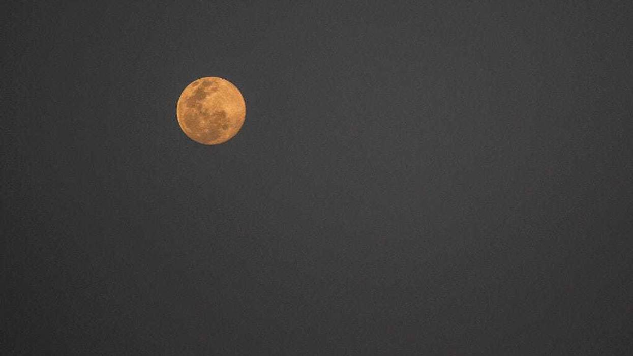 A "Snow Moon" during the Makha Bucha (Māgha Pūjā) Day ceremony on February 26, 2021 in Bangkok, Thailand. Makha Bucha Day is one of the holiest days in Buddhism and is celebrated on the full moon of the third lunar month. The holiday commemorates the day when 1,250 monks gathered to be ordained by Buddha.