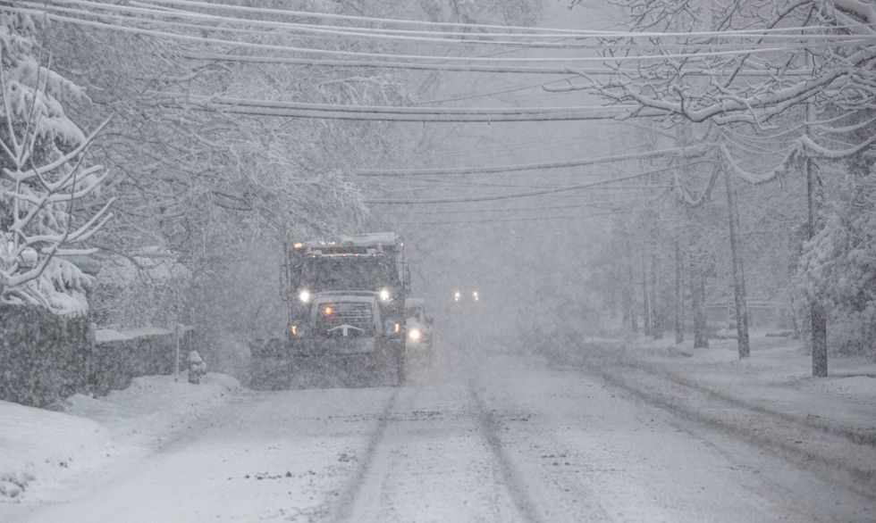 A snowplow clears snow along route 9 in Irvington, Westchester County, on Feb. 13, 2024