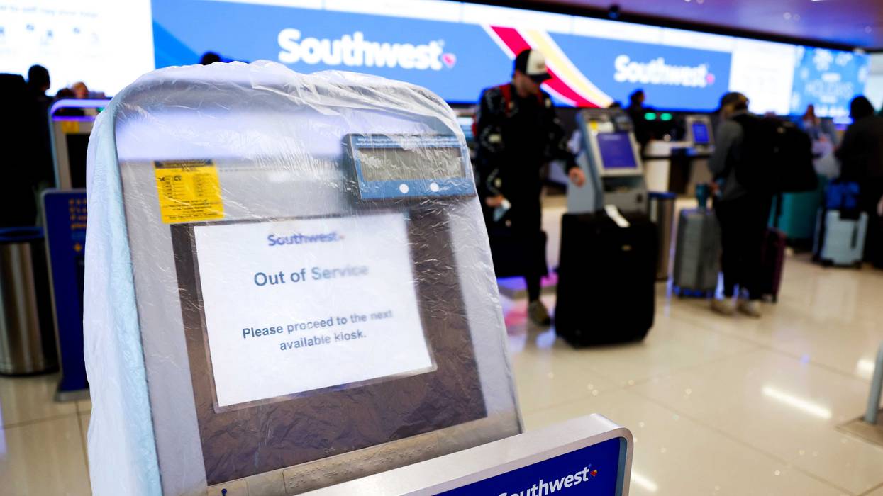 A Southwest Airlines check-in kiosk is covered by plastic as it sits out of service at Denver International Airport on December 28, 2022 in Denver, Colorado. More than 15,000 flights have been canceled between Dec. 22-28 by airlines since winter weather began impacting air travel.