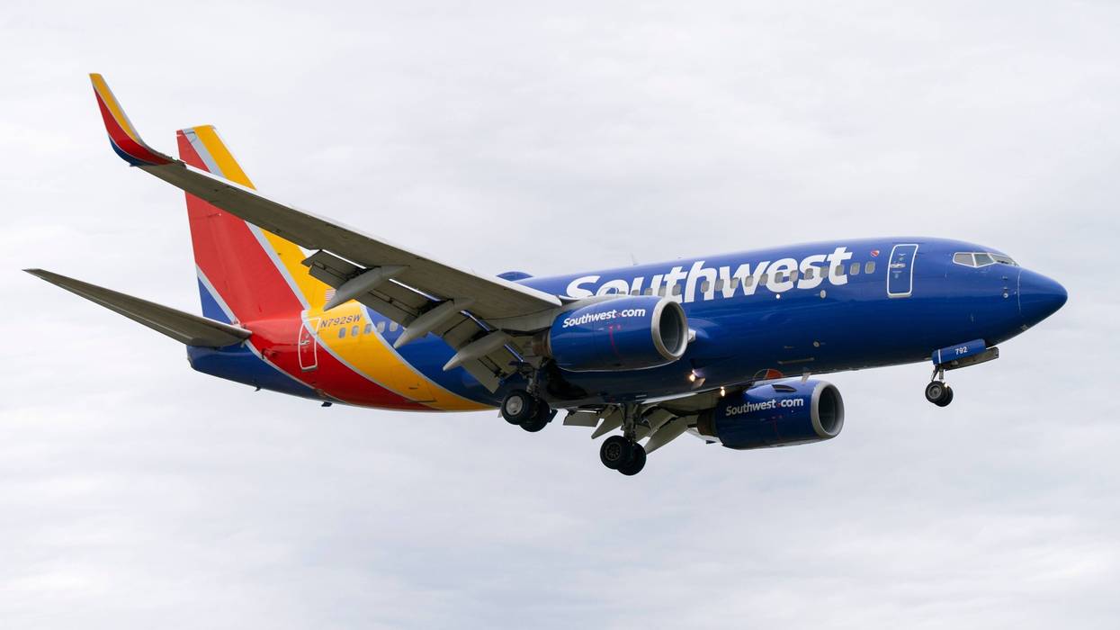 A Southwest Airlines flight prepares to land at Reagan National Airport, in Arlington, Va., Monday, Dec. 27, 2021. A Southwest Airlines flight attendant suffered a compression fracture to a vertebra in her upper back during a hard landing in July 2022 in California, according to federal safety investigators.
