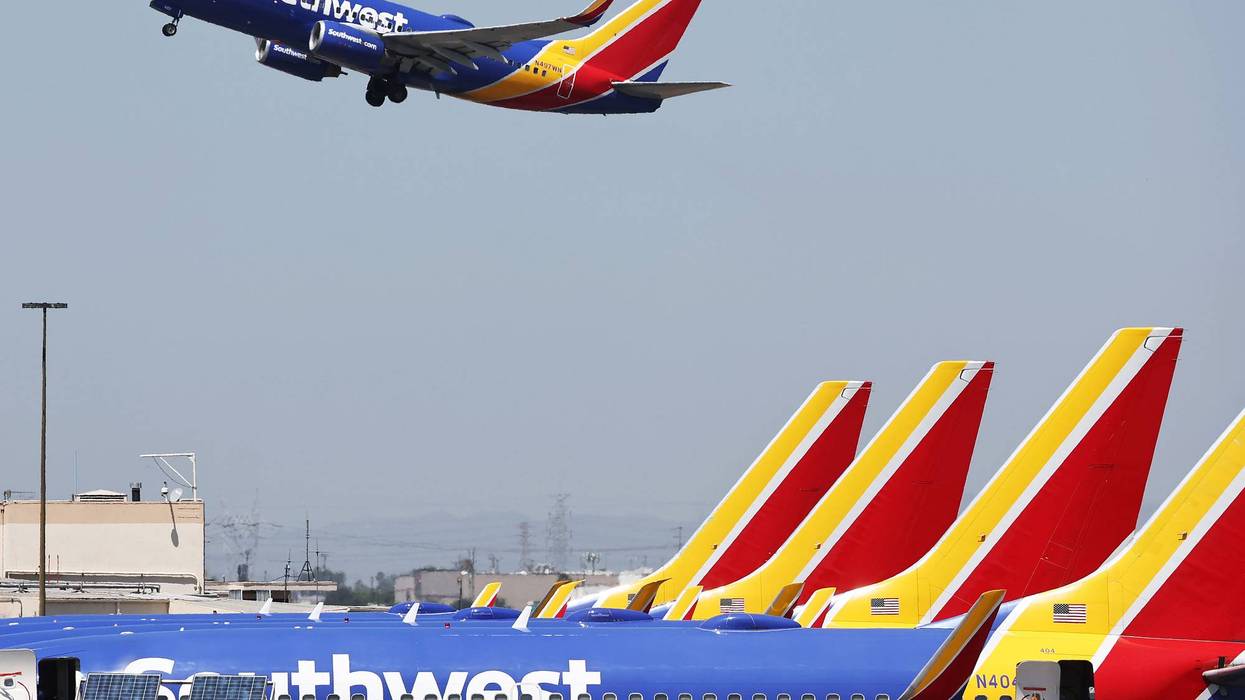 A Southwest Airlines plane takes off from Hollywood Burbank Airport as other Southwest planes are parked at their gates on July 25, 2024, in Burbank, California.