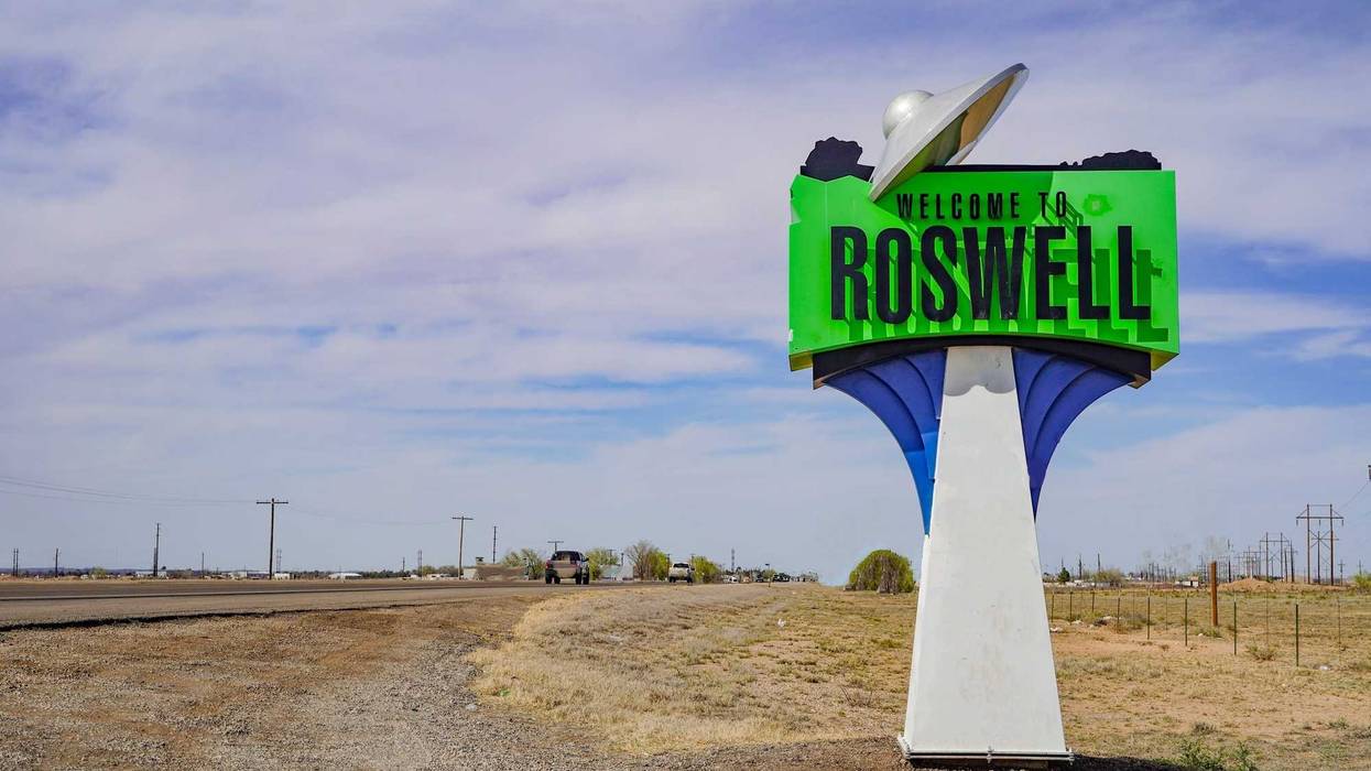 A spaceship on the Welcome to Roswell sign in New Mexico, USA.