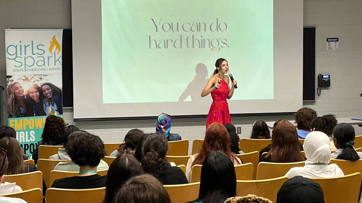 A speaker addresses girls at the 2023 Girls Spark Summit at Penn State's Brandywine campus.