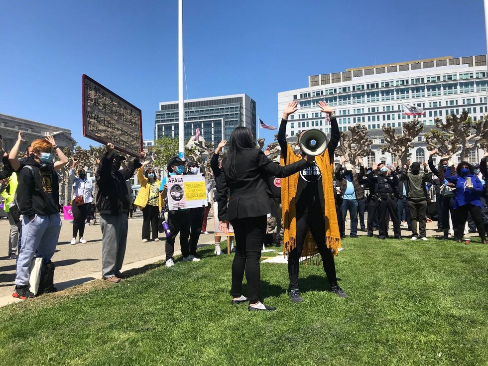 A speaker rallies up the crowd at a San Francisco Solidarity event.