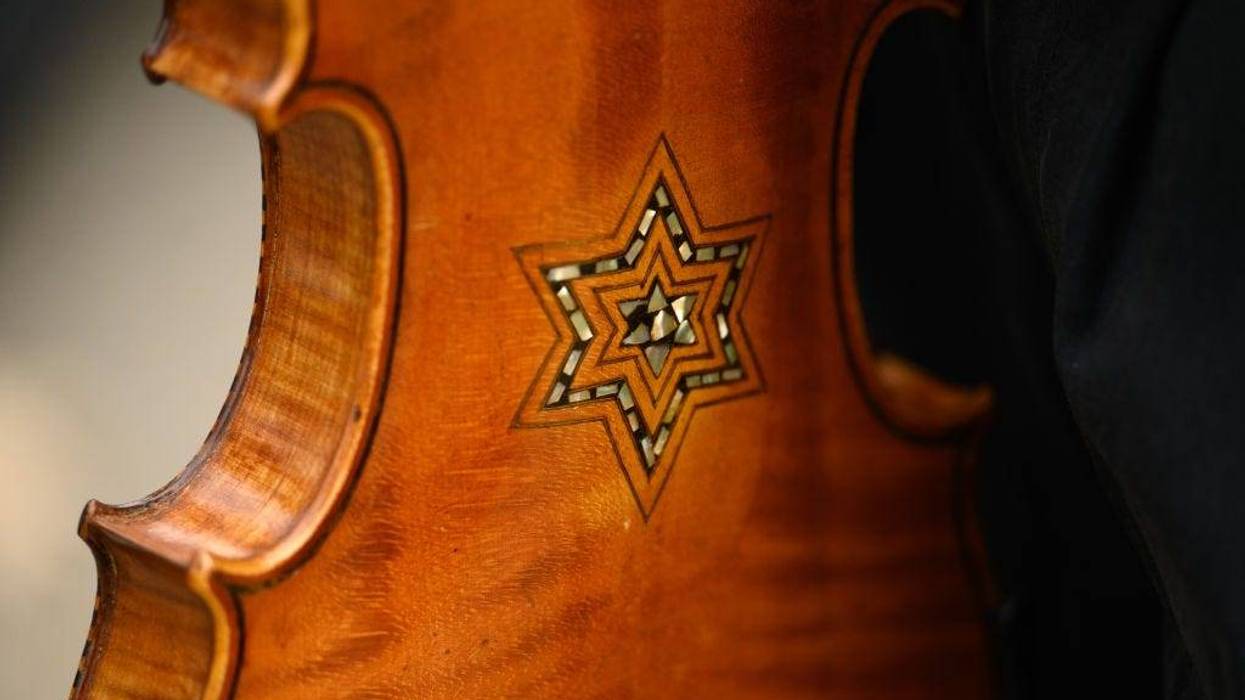 A Star of David adorns a violin that is part of the Violins of Hope, instruments played by Jewish musicians during the Holocaust, which were played during the Commemoration Ceremony on the fifth anniversary of the Tree of Life synagogue attack on October 27, 2023 in Pittsburgh, Pennsylvania.