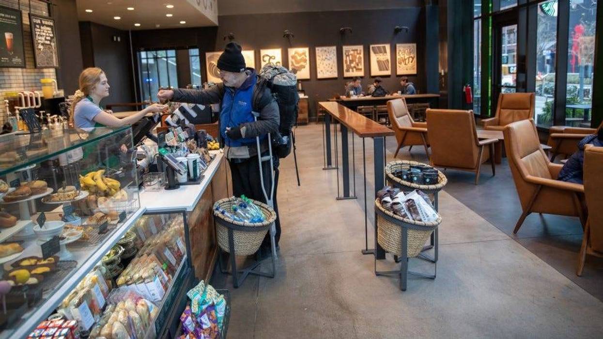 A Starbucks coffee shop sits mostly empty at Amazon headquarters on March 10, 2020 in downtown Seattle, Washington.