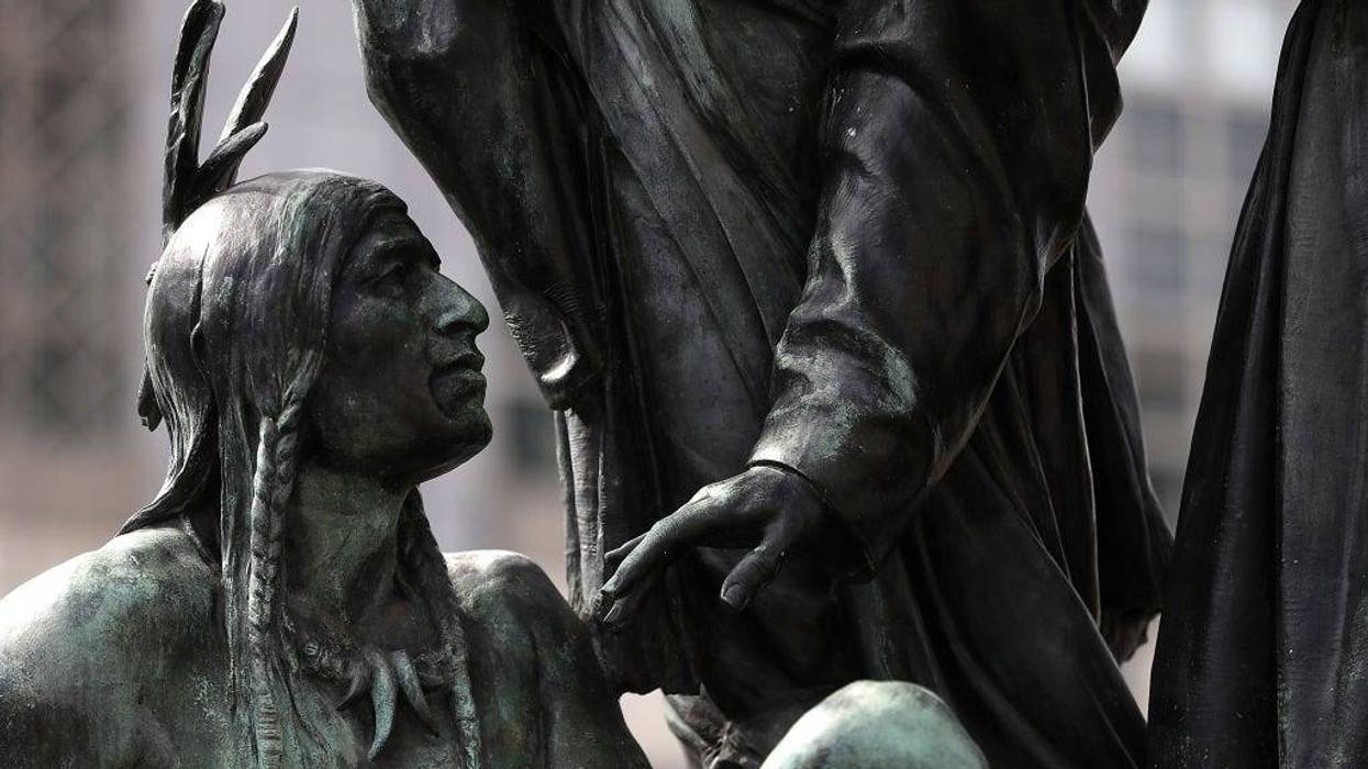 A statue known as "Early Days" that depicts a Native American at the feet of a Catholic missionary and Spanish cowboy stands on Fulton Street as part of the Pioneer Monument on March 12, 2018 in San Francisco, California.