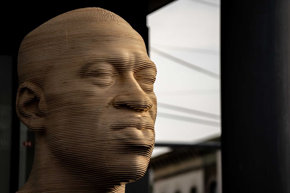 A statue of George Floyd is unveiled at Flatbush Junction on June 19, 2021, in the Brooklyn borough of New York City