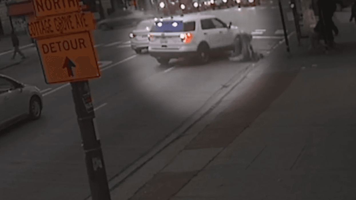 A still image from surveillance footage shows Bernard Kersh being body-slammed by a Chicago police officer after he allegedly spat in the officer’s face on Thanksgiving in 2019.