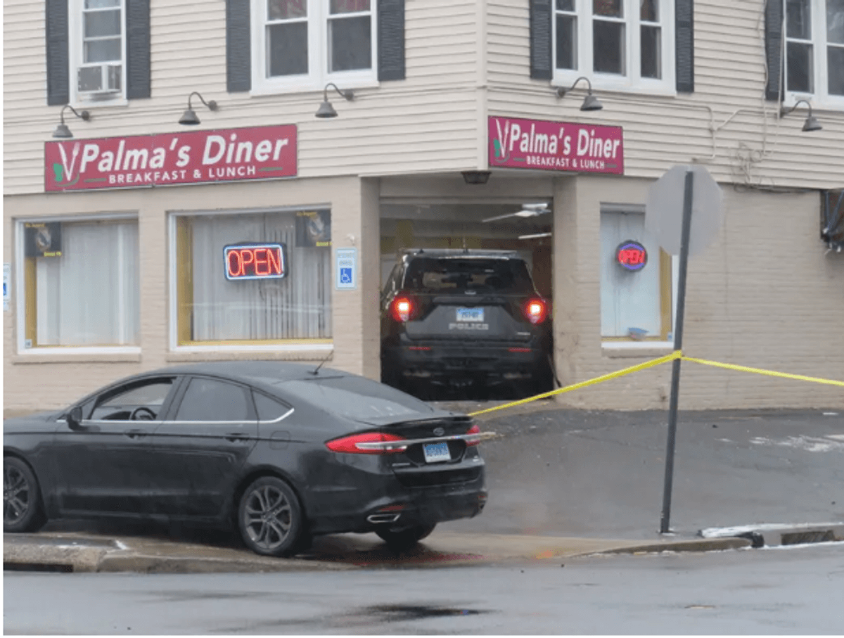 A stolen police SUV is lodged in the front entrance of Palma's Diner in Bristol, 1/12/23.