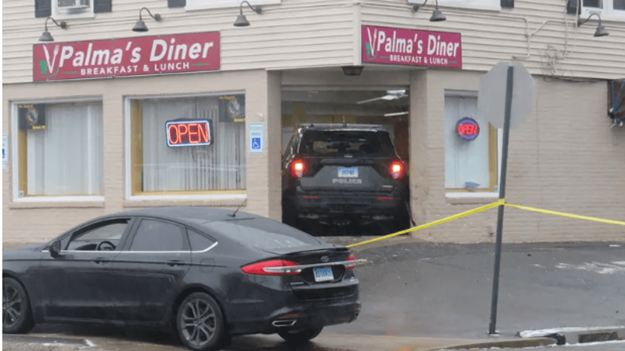 A stolen police SUV is lodged in the front entrance of Palma's Diner in Bristol, 1/12/23.
