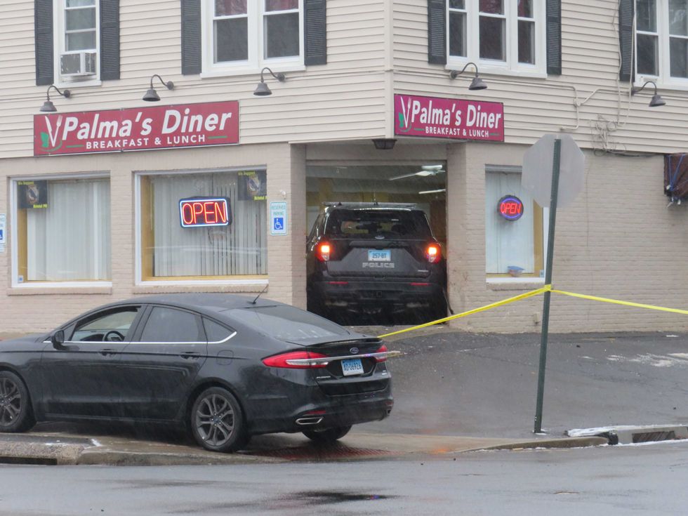 A stolen police SUV is lodged in the front entrance of Palma