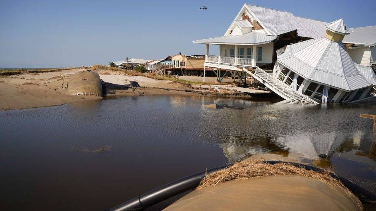 A storm-damaged house at a busted levy on the beach after Hurricane Ida on September 4, 2021 in Grand Isle, Louisiana. Ida made landfall as a Category 4 hurricane six days before in Louisiana and brought flooding, wind damage and power outages along the Gulf Coast. (Photo by Sean Rayford/Getty Images)