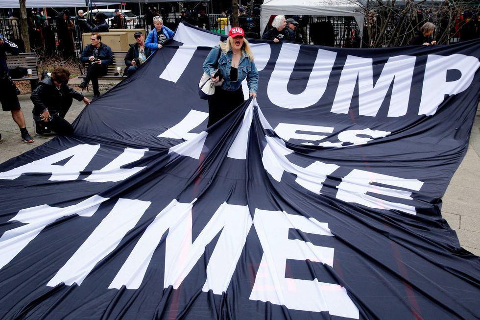 A supporter of Donald Trump argues with opponents outside Manhattan Criminal Court on April 4, 2023