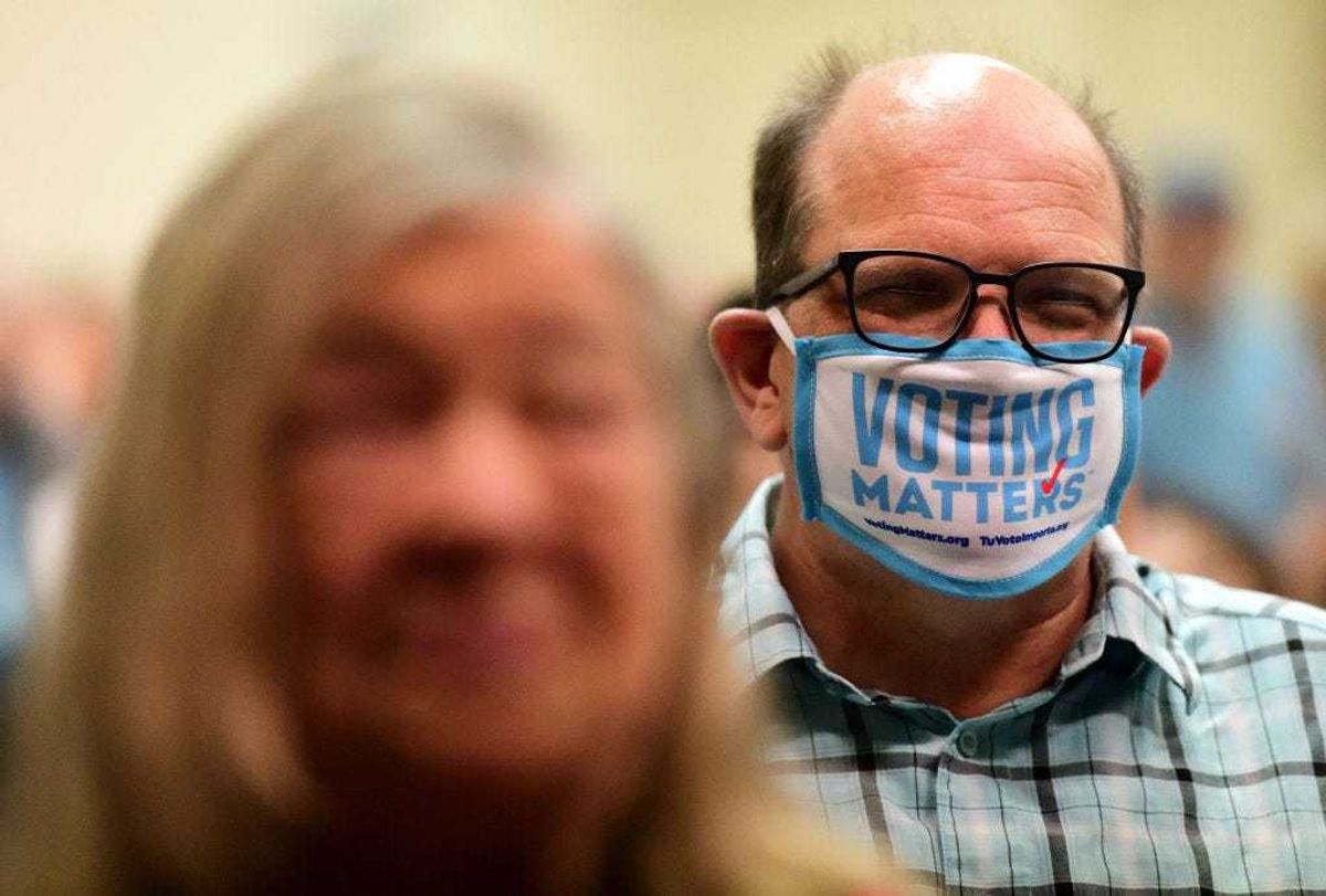 A supporter wears a face mask that states "VOTING MATTERS" while listening to Pennsylvania Attorney General and Democratic Nominee for Governor Josh Shapiro during a Northampton County Meet & Greet event at United Steelworkers on September 22, 2022 in Bethlehem, Pennsylvania. Shapiro faces Republican challenger Doug Mastriano for the general election in November. (Photo by Mark Makela/Getty Images)