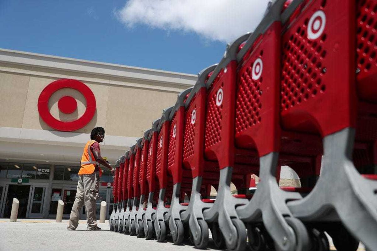 A Target store employee collects shopping carts to bring back into the store on August 21, 2019 in Pembroke Pines, Florida.