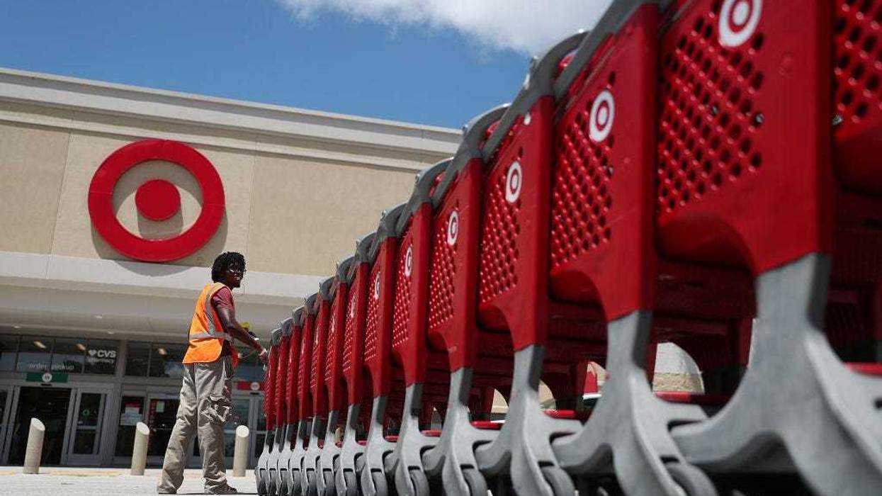 A Target store employee collects shopping carts to bring back into the store on August 21, 2019 in Pembroke Pines, Florida.