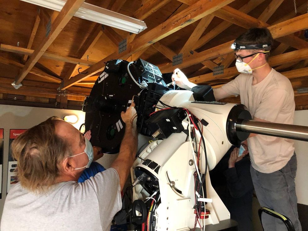 A team of researchers disassemble, detach and remove telescopes worth almost $1 million from the observatory.