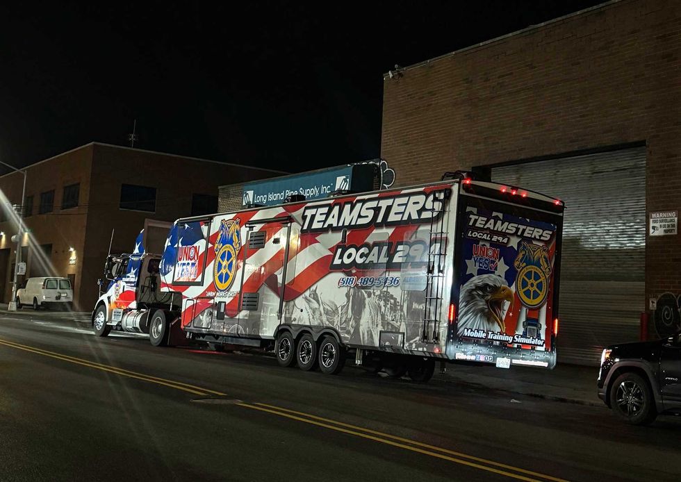 A Teamsters mobile is seen outside the Maspeth warehouse on Thursday