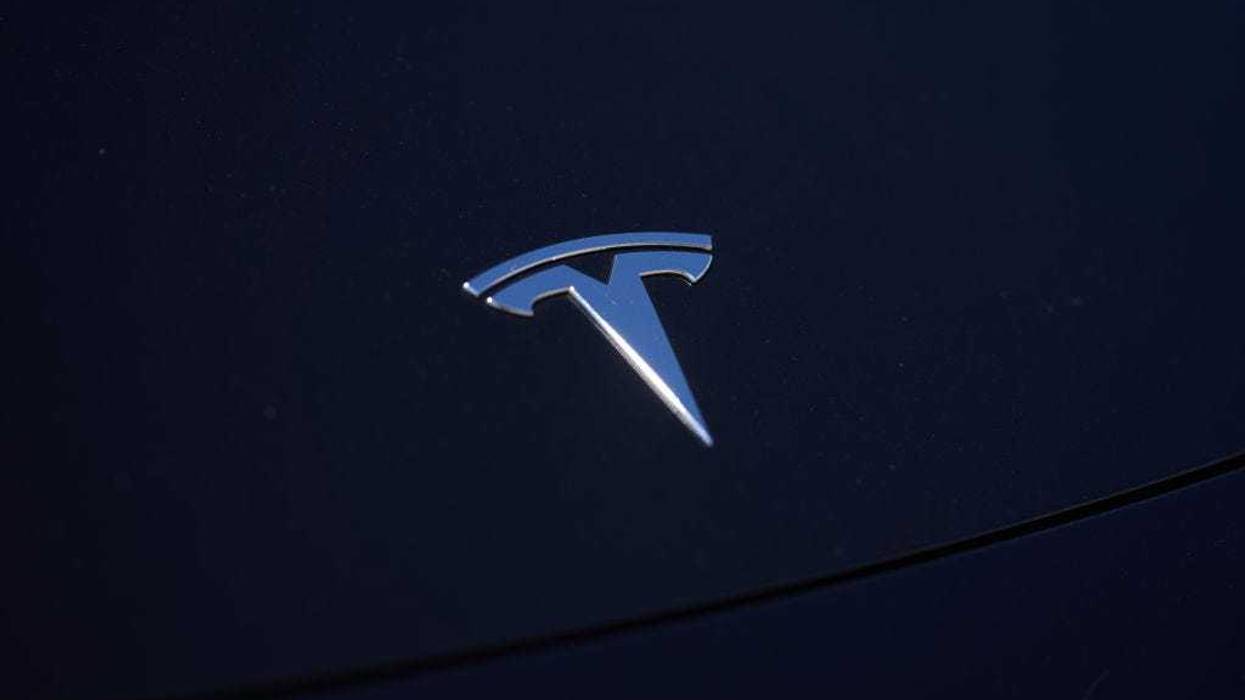 A Tesla logo is seen on a vehicle in a parking lot on September 22, 2022 in Santa Monica, California.