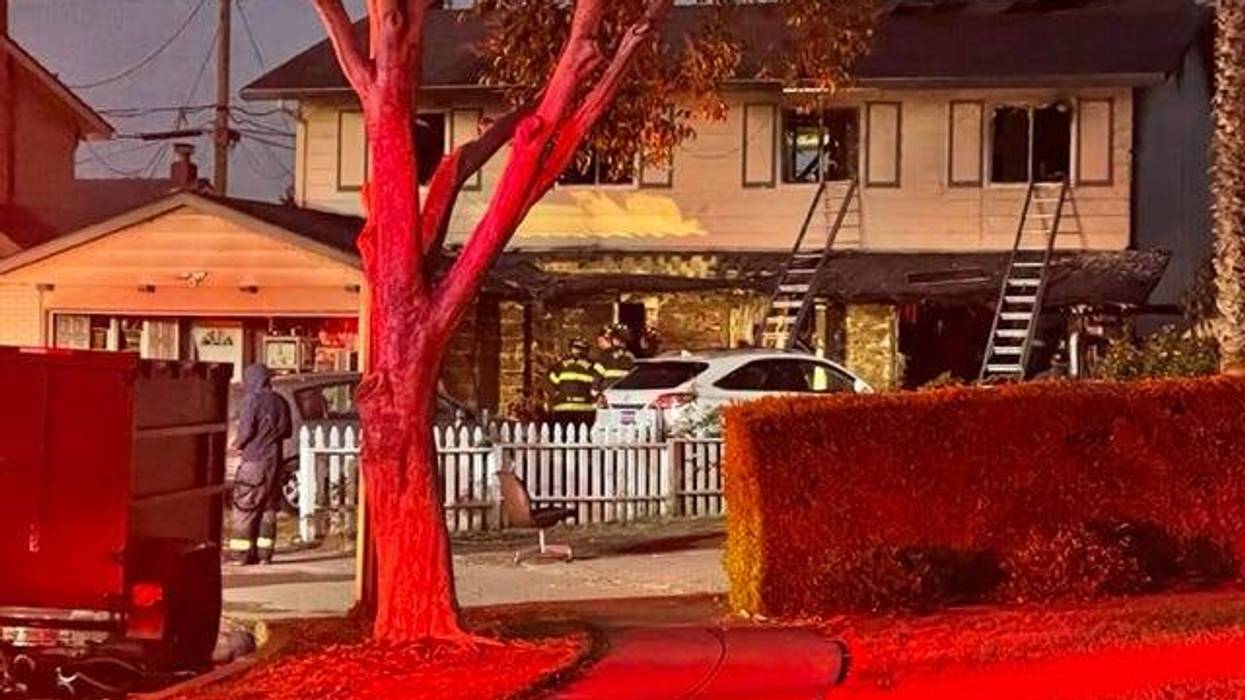 A three-alarm fire engulfed a San Jose home on Tuesday and killed one woman.