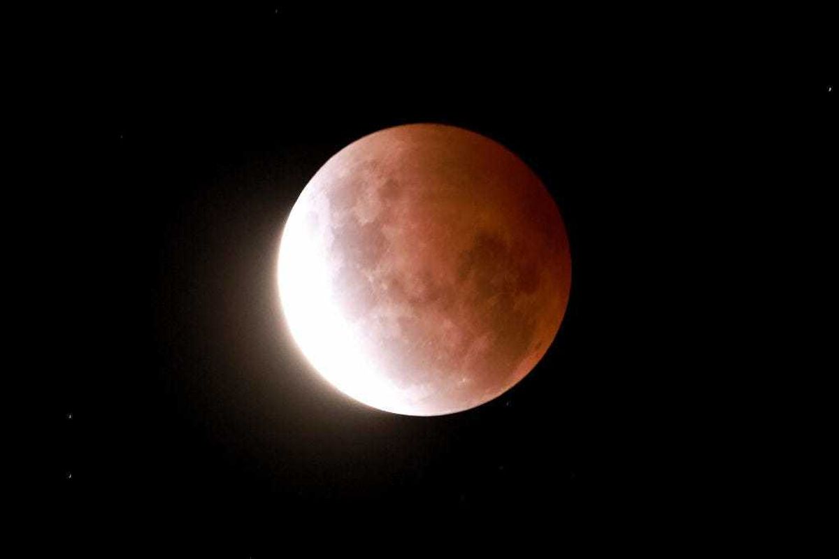 A total eclipse of a super moon beginning with a partial eclipse on May 26, 2021 in Auckland, New Zealand. (Photo by Phil Walter/Getty Images)
