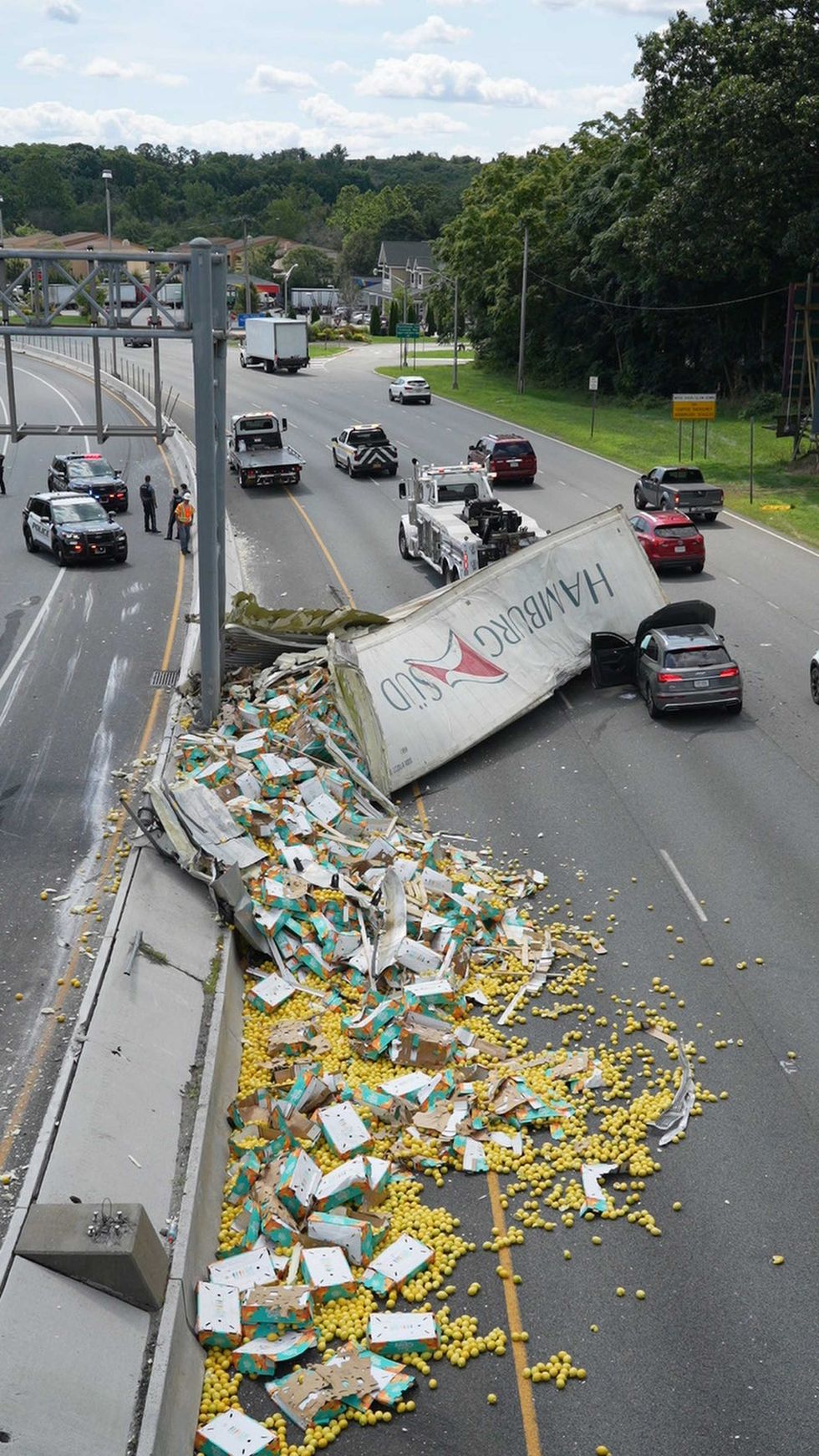 A tractor trailer hauling lemons lost its trailer over the jersey barrier striking an on coming vehicle in the southbound lanes of Route 17 in Mahwah, NJ on Wednesday Aug. 2, 2023
