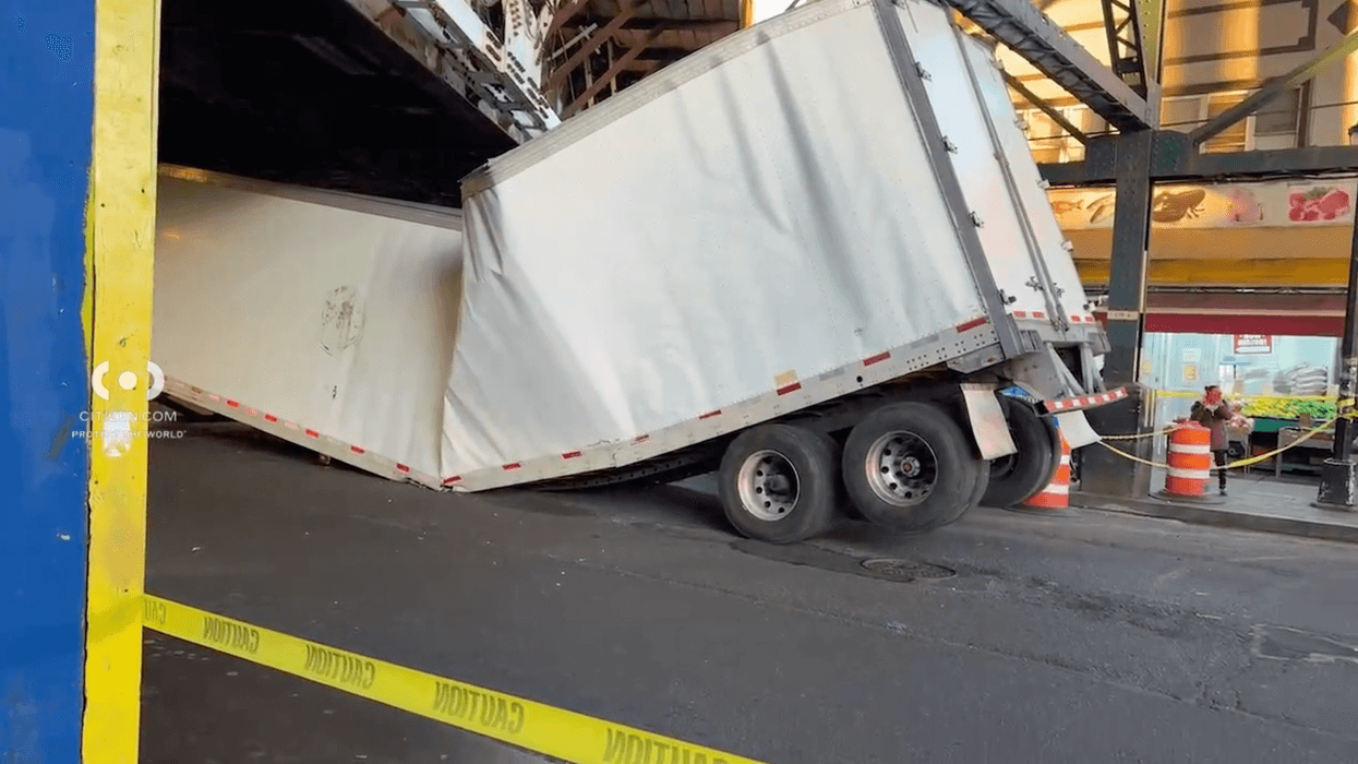 A tractor-trailer truck driver crashed into the elevated Woodside 7 train station on Thursday morning