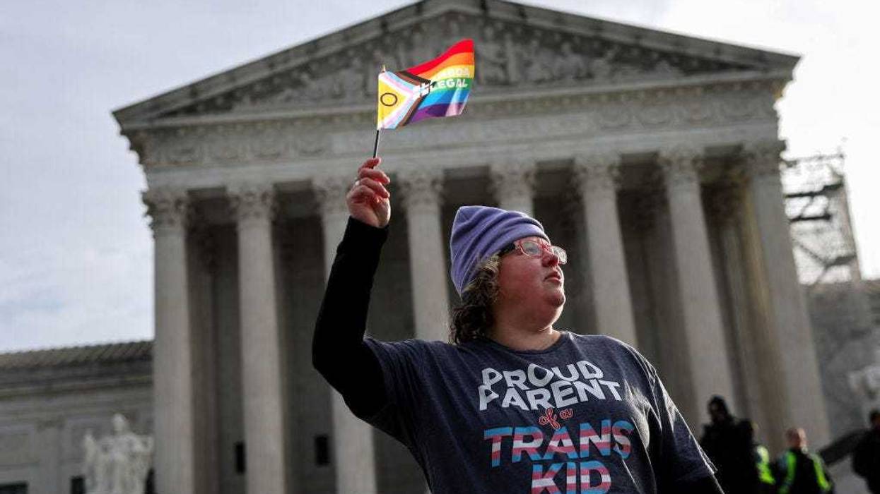 A transgender rights supporter takes part in a rally outside of the U.S. Supreme Court as the justices hear arguments in a case on transgender health rights on December 04, 2024 in Washington, DC. Wednesday, the court upheld Tennessee’s ban on gender-affirming care for transgender minors, a stunning setback to transgender rights.