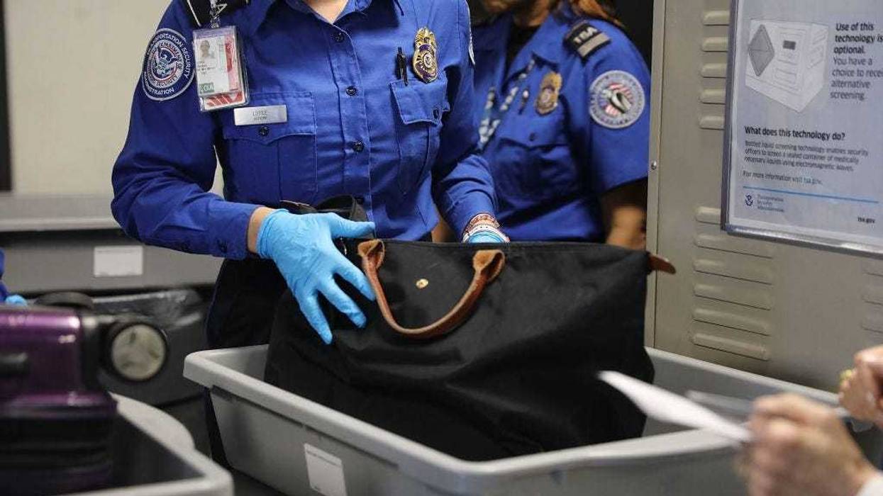 A Transportation Security Administration (TSA) worker screens luggage at LaGuardia Airport (LGA) on September 26, 2017 in New York City.