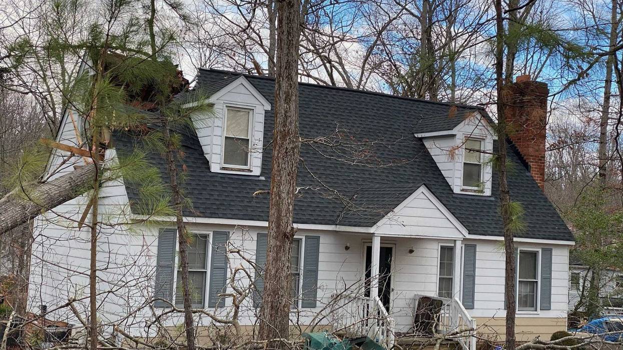 A tree falls into a home in Chesterfield County. (Lt. Jason Elmore, Chesterfield Fire)