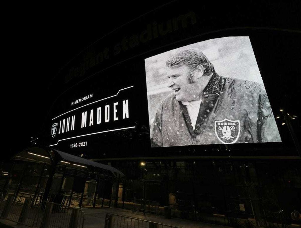 A tribute to former Raiders head coach, Pro Football Hall of Fame member and broadcaster John Madden is displayed on the side of Allegiant Stadium, home of the Las Vegas Raiders, after news of his death at the age of 85 on December 28, 2021 in Las Vegas, Nevada.