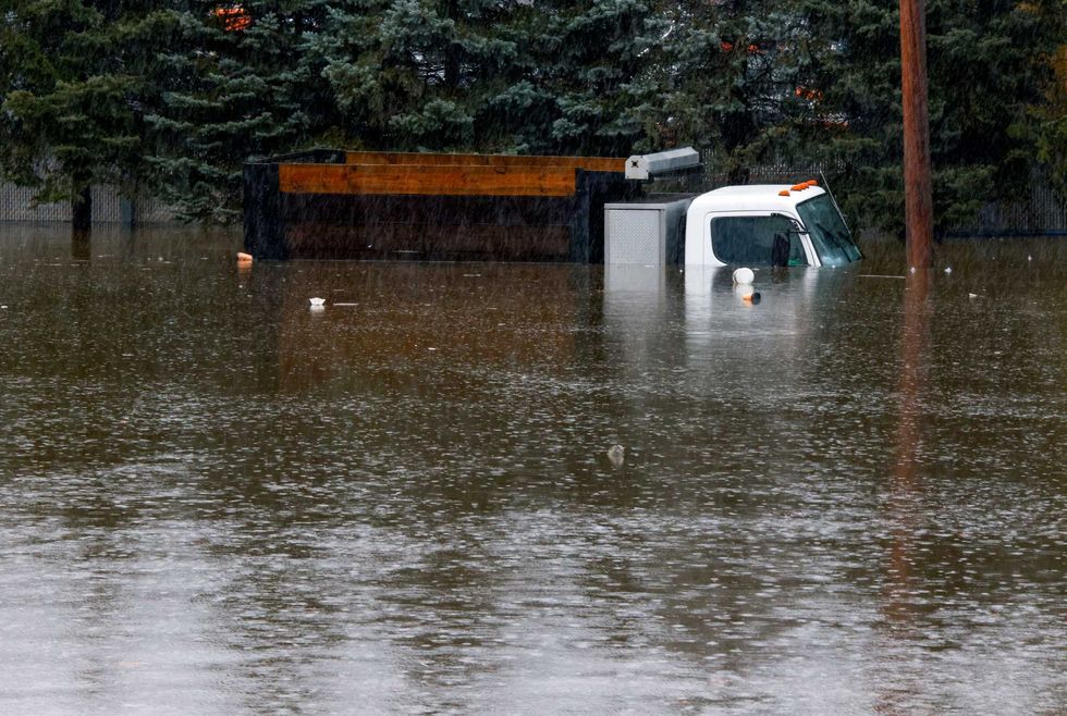 A truck is submerged in floodwater in Elmsford on Dec. 18, 2023