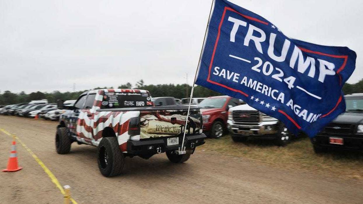 A truck with a 'Trump 2024' flag arrives at a "Save America" rally with former President Donald Trump at York Family Farms on August 21, 2021 in Cullman, Alabama.