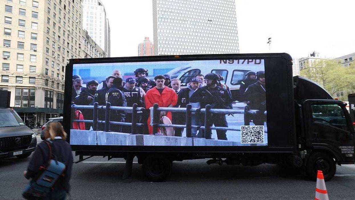 A truck with a video screen outside Manhattan Federal Court on April 25, 2025 to attend court as Luigi Mangione is set to be arraigned in New York federal court on a four-count indictment for the murder of United Healthcare CEO Brian Thompson.